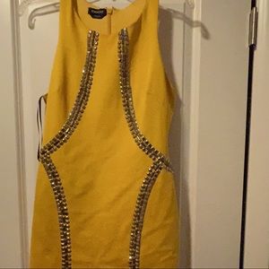 Yellow Bebe dress with metal detail!